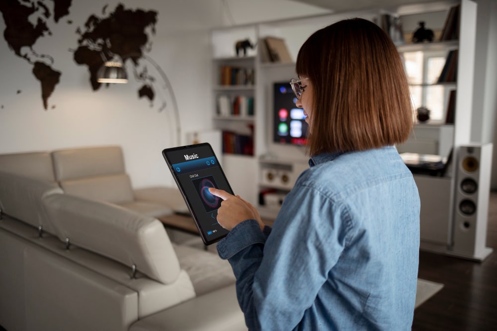 Image illustrating a woman using a smart electrical home system