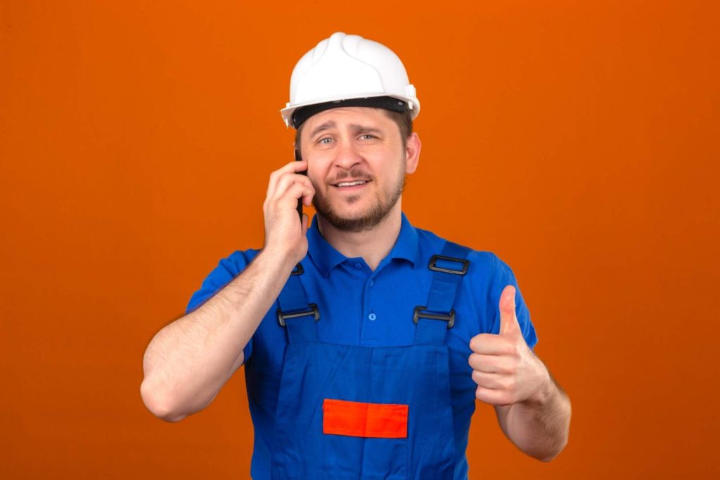24/7 emergency electrician in New York talking on the phone