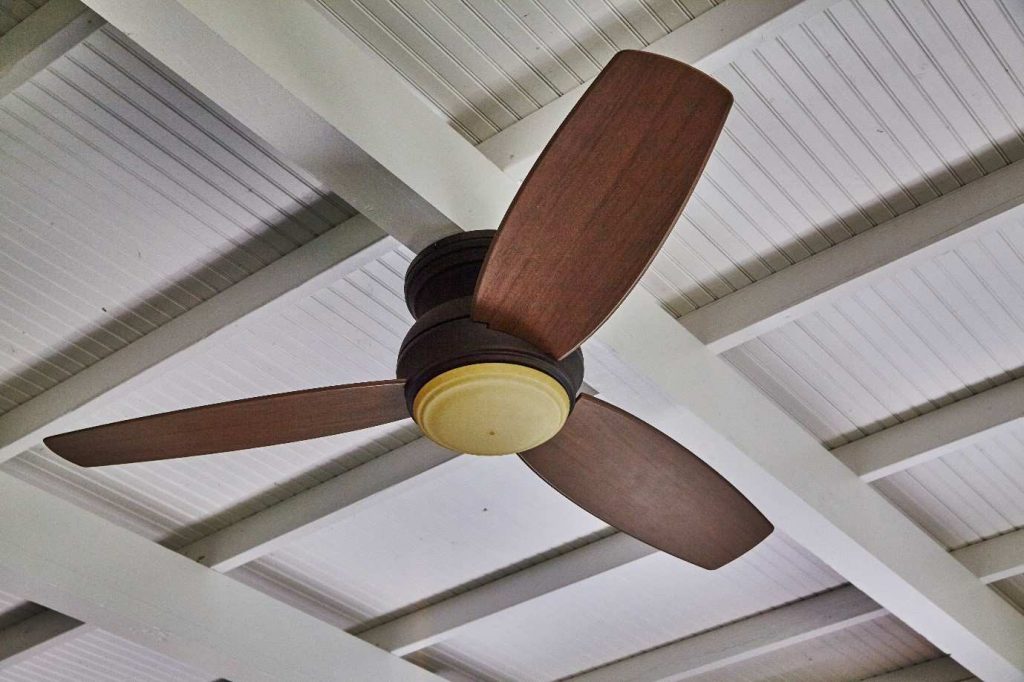 Image illustrating a ceiling fan set up by a professional ceiling fan installer in New York.