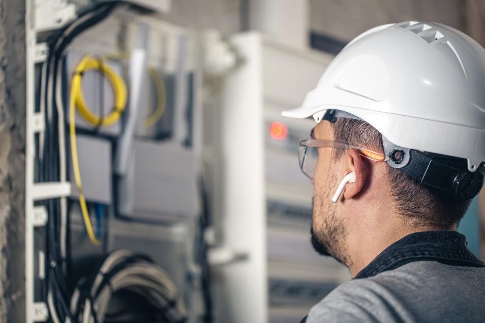 Professional electrician conducting an inspection in New York